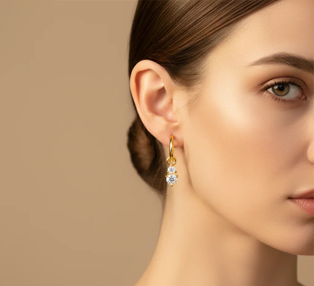 Aurilyn 925 sterling silver earring collection displayed with minimalist modern styling, showcasing polished studs and hoops for daily wear.