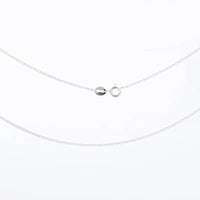 Silver necklace with a small round pendant on a white background
