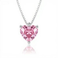 Pink heart-shaped gemstone necklace on a white background