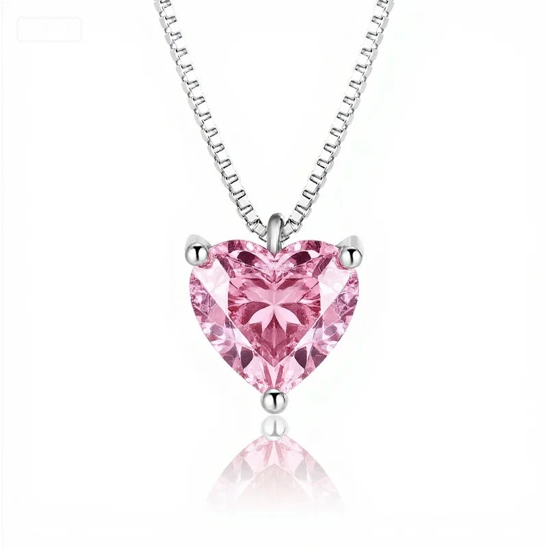 Pink heart-shaped gemstone necklace on a white background