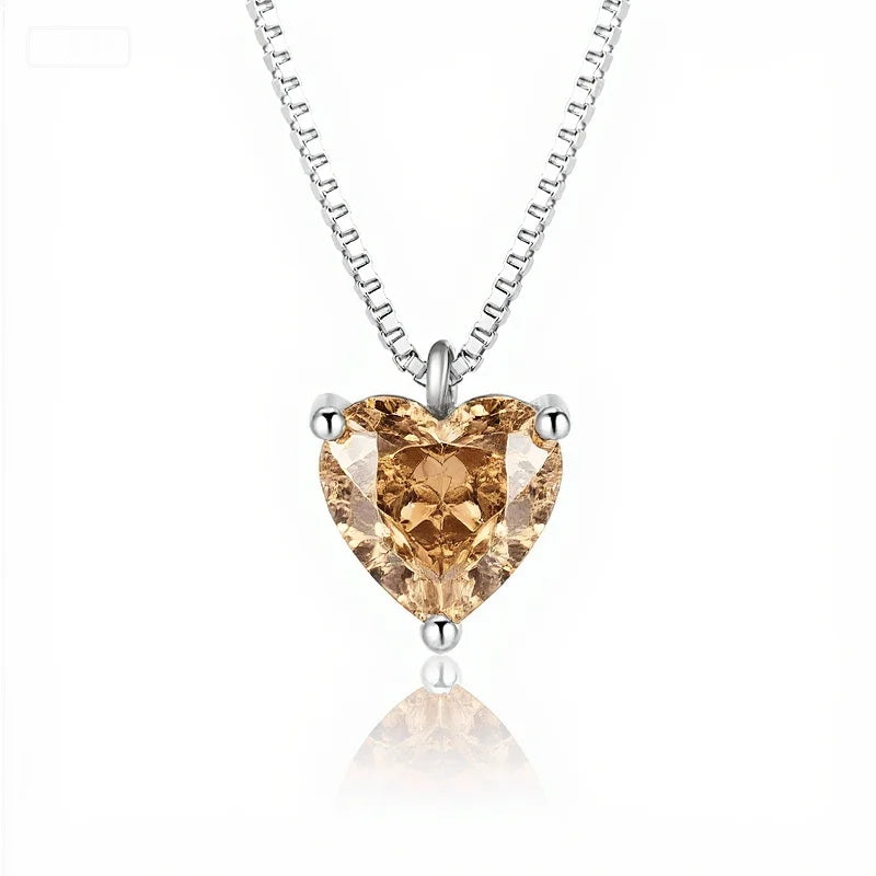 Heart-shaped diamond pendant on a white background