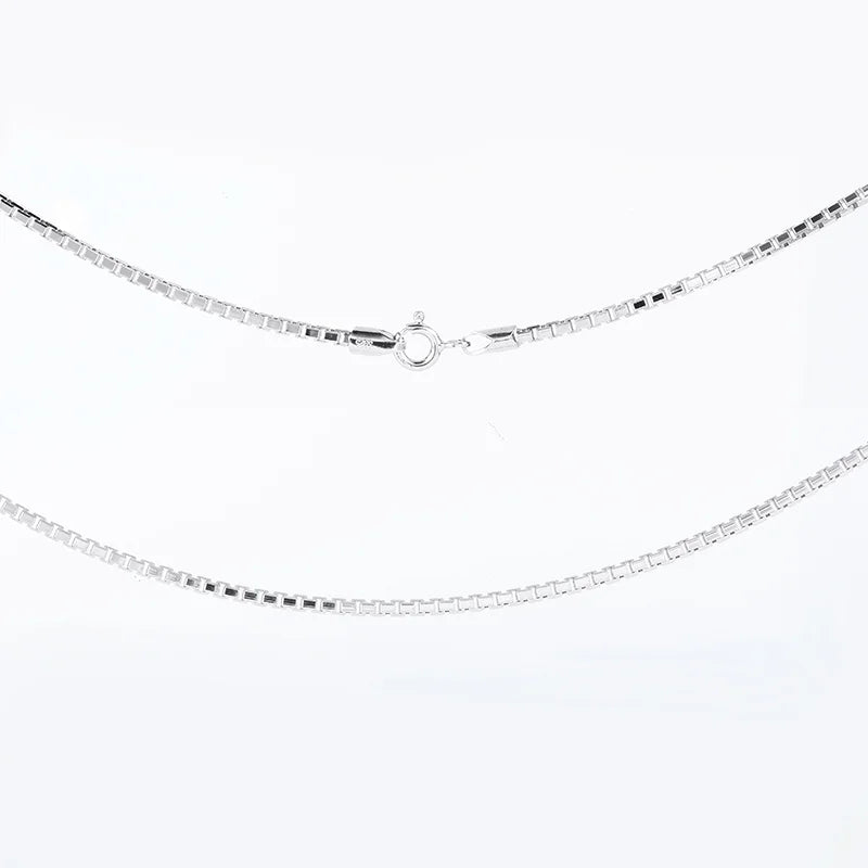 Silver chain necklace on a white background