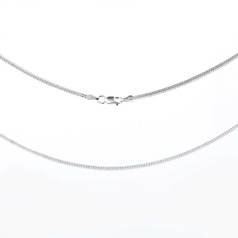 Silver chain necklace on a white background