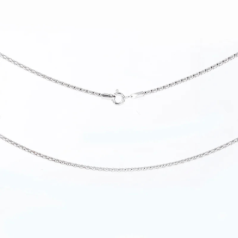 Silver chain necklace on a white background
