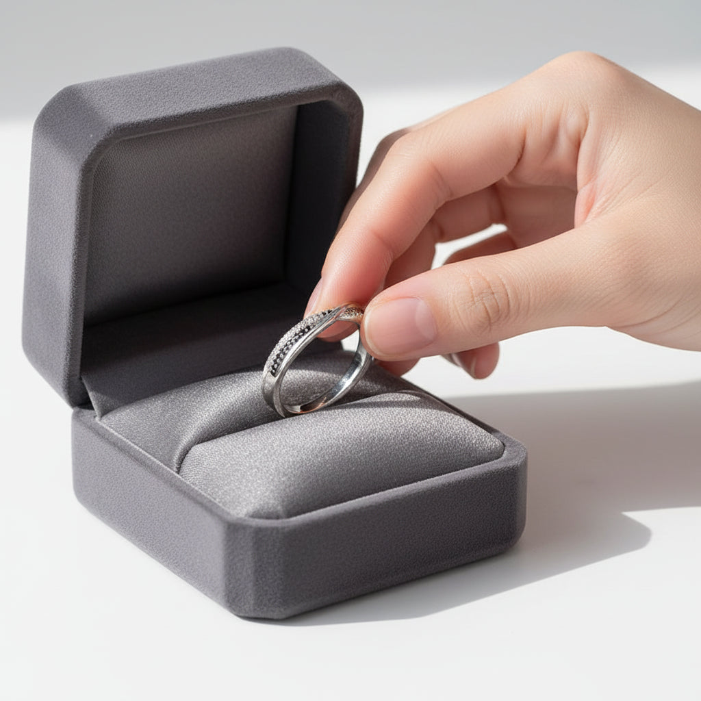 Silver ring with small stones on a white background