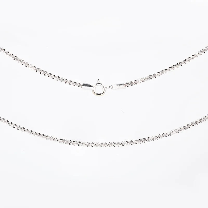 Silver necklace with small diamonds on a white background