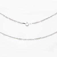 Silver necklace with small diamonds on a white background