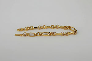 Gold vermeil mixed-link chain bracelet with lobster clasp and extender tag on a clean light background