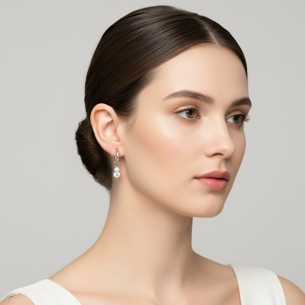 Aurilyn Dainty CZ Drop Hoop Earrings, close-up view showing the brilliant cut cubic zirconia stones and hinged clasp, available in silver and gold